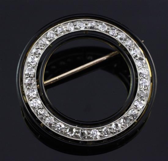 A 1930s/1940s gold, black onyx and diamond brooch, in Cartier box.